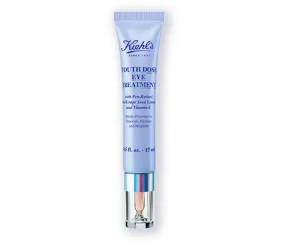 A tube of Kiehl's Youth Dose Eye Treatment, featuring a lavender design, claims to smooth, hydrate, and brighten under-eye areas.