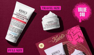 En bild som visar en vit "KIEHL'S ULTRA FACIAL BARRIER-HYDRATING CLEANSER"-tub markt "FULL SIZE" och en mindre vit "KIEHL'S ULTRA FACIAL CREAM"-burk markt "TRAVEL SIZE". Upptill hoger finns en rosa, stankt textruta som sager "VALUE $40". En delvis Kiehl's presentask med en rosa grafisk rosett syns i nedre hogra hornet.