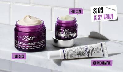Image of Kiehl's skincare products featuring a full-size multi-corrective cream in a purple jar and a deluxe sample of a cream in a tube. The text highlights the full-size products, priced at $105, with a total value of $157.