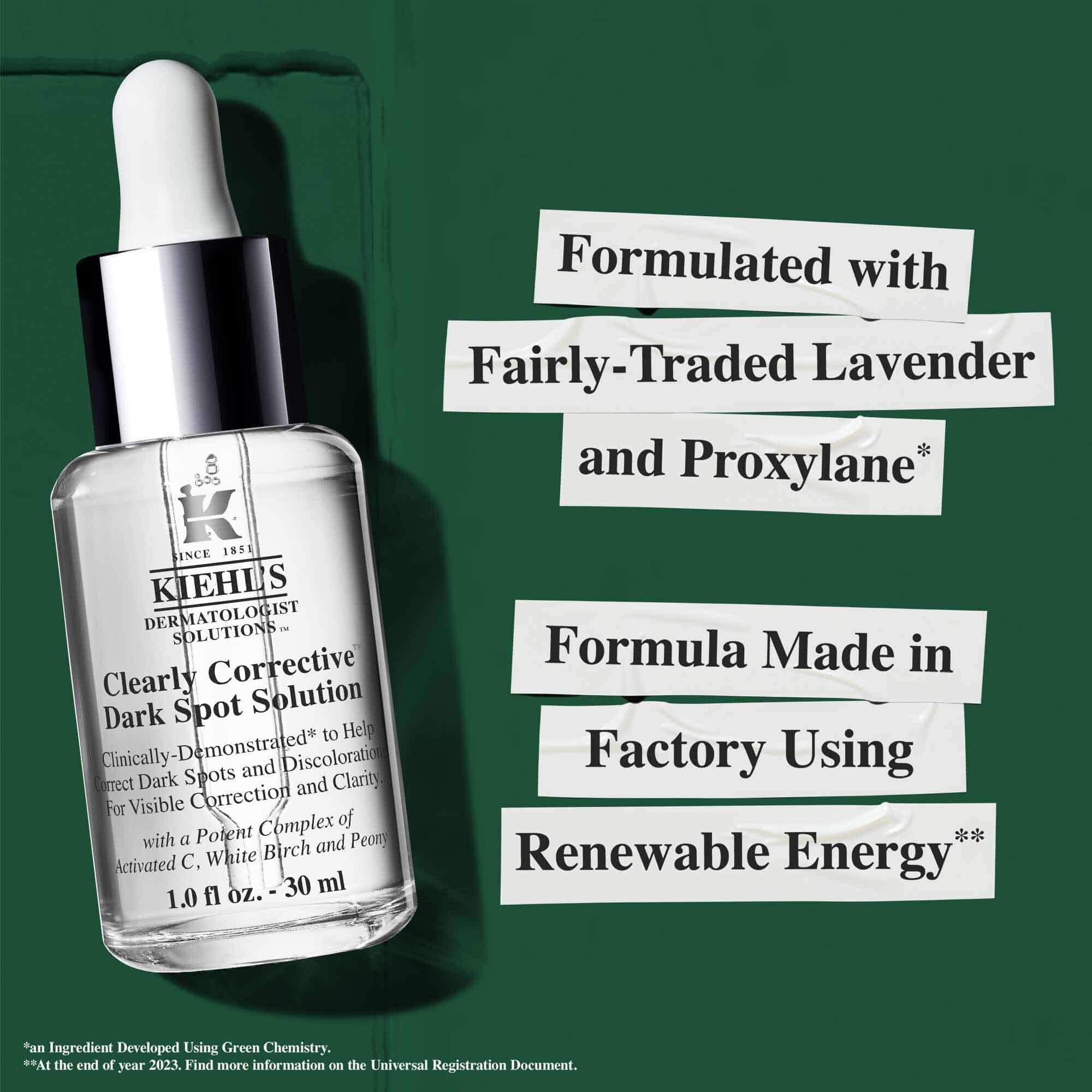 Flaska med Clearly Corrective Dark Spot Solution med hållbarhetspåståenden om fornybar energi och återvunnet glas.