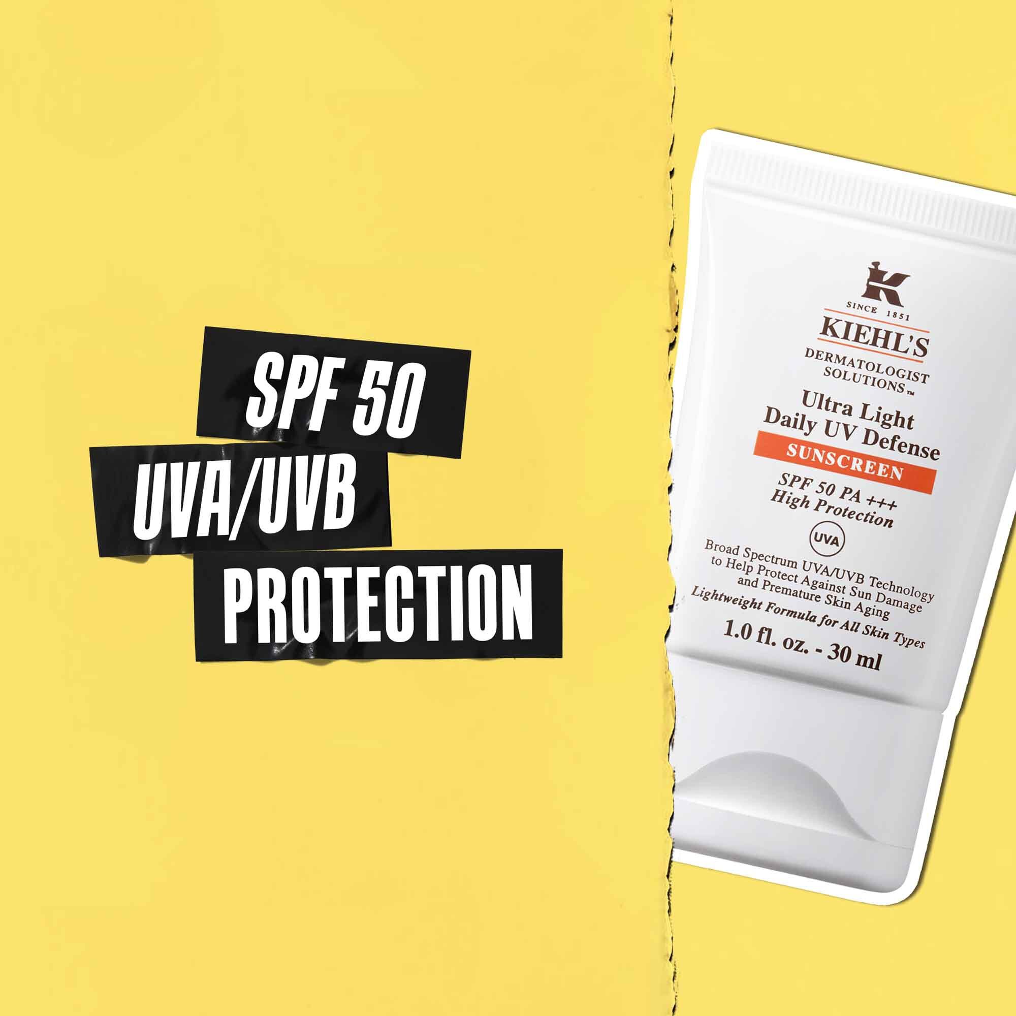 Utrop om SPF 50 UVA/UVB-skydd på svart tejp med en bild av Ultra-Light Daily UV Defense-tuben bredvid.