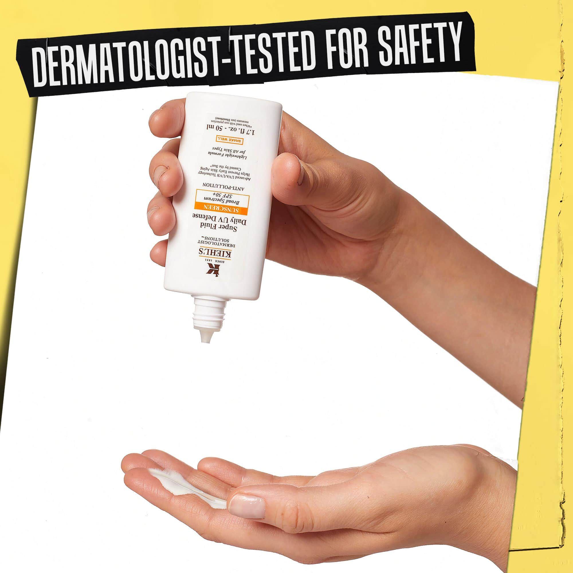 Hand dar Ultra-Light Daily UV Defense doseras, markt "Dermatologiskt testad for sakerhet".