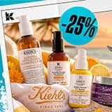Kiehl's hudvårdsprodukter inklusive ansiktstvätt, serum och kräm med 25% rabatt, mot en solnedgång på stranden i bakgrunden.